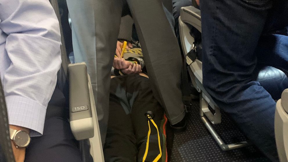 Flight From Tokyo Diverted After Passenger Tries To Open Emergency Exit Flight From Tokyo Diverted After Passenger Tries To Open Emergency Exit