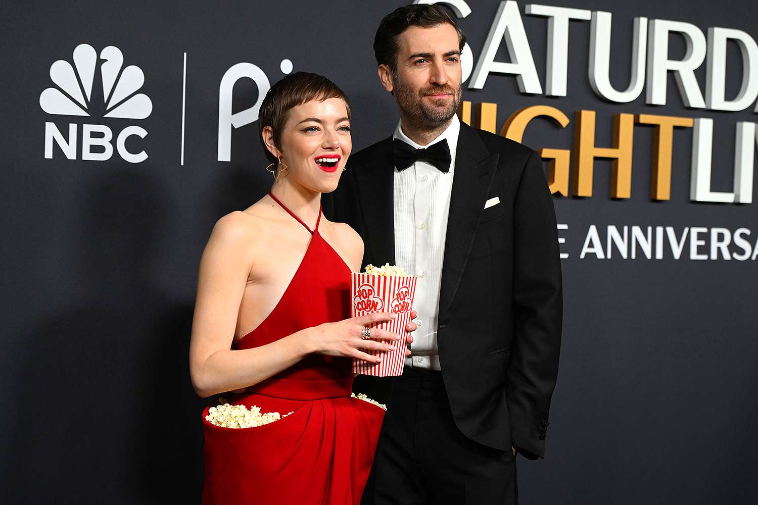See The Photos: Emma Stone's Stunning Dress At SNL's 50th Anniversary See The Photos: Emma Stone's Stunning Dress At SNL's 50th Anniversary
